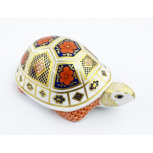 151 - A Royal Crown Derby paperweight modelled as a tortoise. Marked under, with gold stopper. Approx. 4 1... 