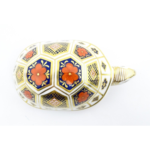 151 - A Royal Crown Derby paperweight modelled as a tortoise. Marked under, with gold stopper. Approx. 4 1... 