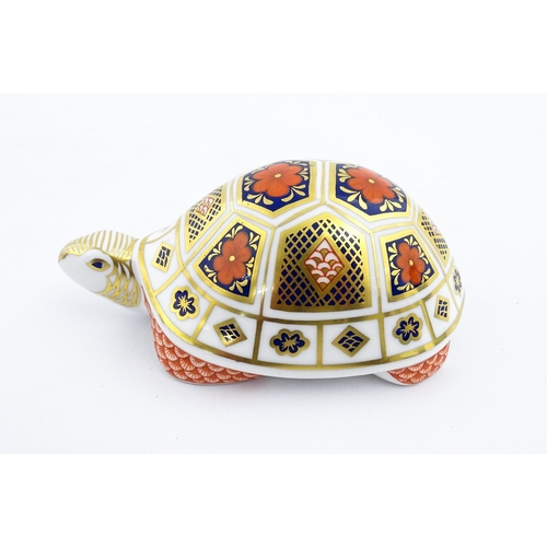 151 - A Royal Crown Derby paperweight modelled as a tortoise. Marked under, with gold stopper. Approx. 4 1... 