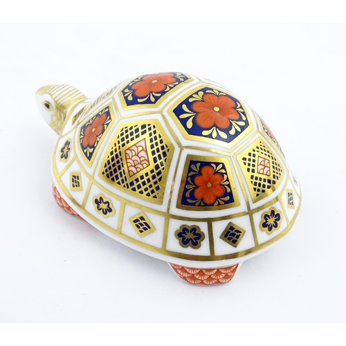 151 - A Royal Crown Derby paperweight modelled as a tortoise. Marked under, with gold stopper. Approx. 4 1... 