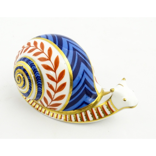 152 - A Royal Crown Derby paperweight modelled as a snail. Marked under, with gold stopper. Approx. 5