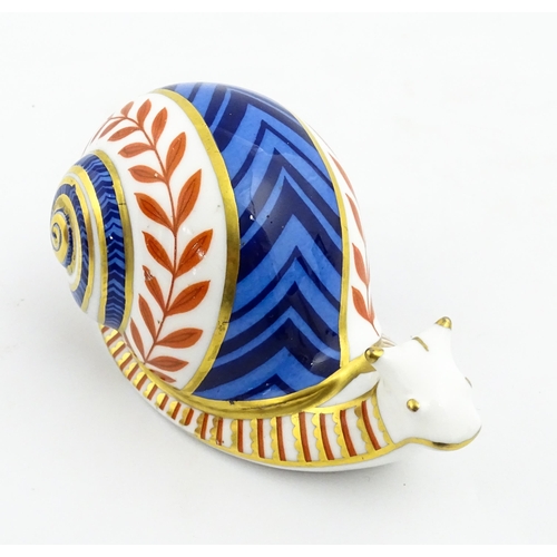 152 - A Royal Crown Derby paperweight modelled as a snail. Marked under, with gold stopper. Approx. 5