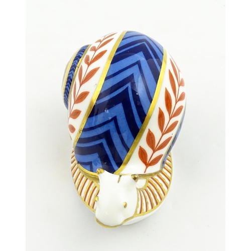 152 - A Royal Crown Derby paperweight modelled as a snail. Marked under, with gold stopper. Approx. 5