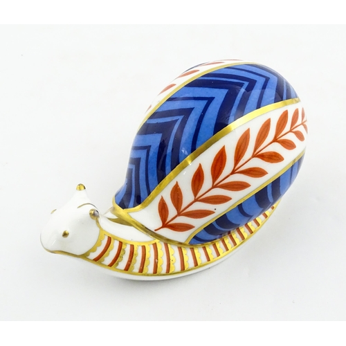 152 - A Royal Crown Derby paperweight modelled as a snail. Marked under, with gold stopper. Approx. 5