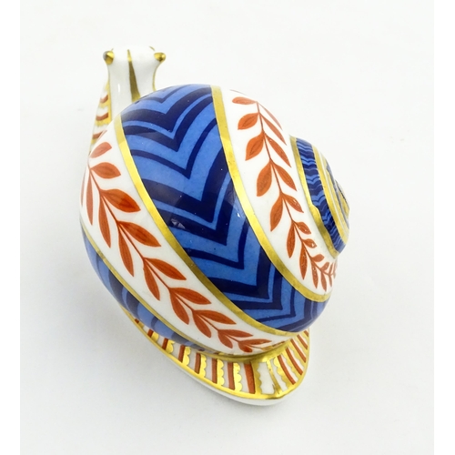 152 - A Royal Crown Derby paperweight modelled as a snail. Marked under, with gold stopper. Approx. 5