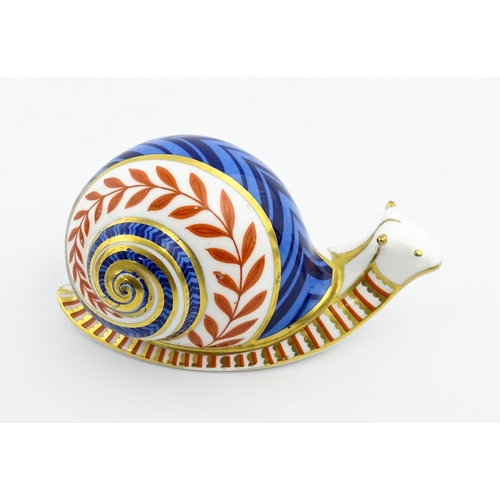 152 - A Royal Crown Derby paperweight modelled as a snail. Marked under, with gold stopper. Approx. 5