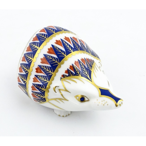 153 - A Royal Crown Derby paperweight modelled as a hedgehog. Marked under. Approx. 4 1/4