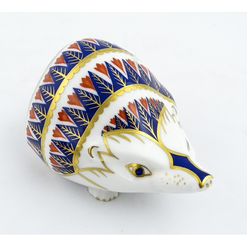 153 - A Royal Crown Derby paperweight modelled as a hedgehog. Marked under. Approx. 4 1/4