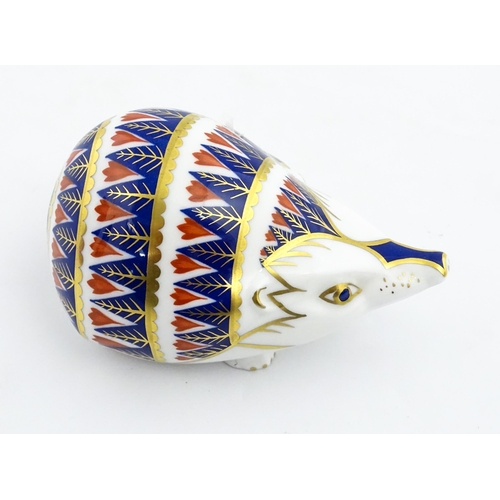 153 - A Royal Crown Derby paperweight modelled as a hedgehog. Marked under. Approx. 4 1/4