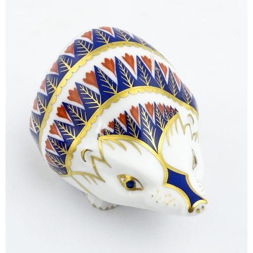 153 - A Royal Crown Derby paperweight modelled as a hedgehog. Marked under. Approx. 4 1/4