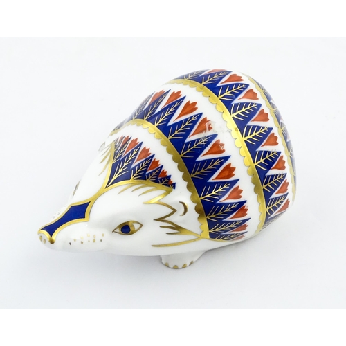 153 - A Royal Crown Derby paperweight modelled as a hedgehog. Marked under. Approx. 4 1/4