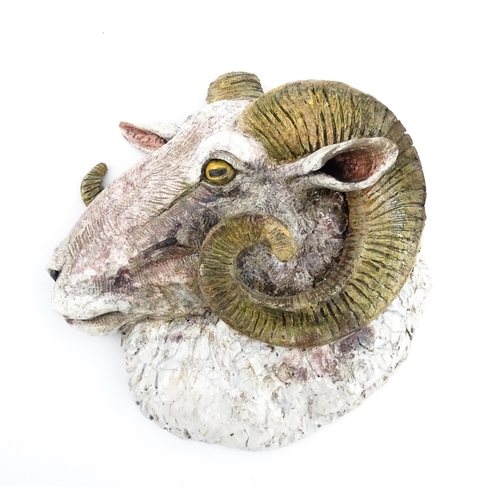 176 - A Sallie Wakley (b. 1967) studio pottery wall hanging plaque modelled as the head of a ram. Signed a... 