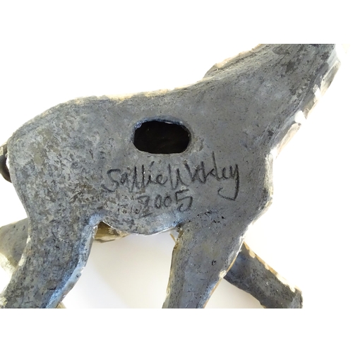 177 - A Sallie Wakley (b. 1967) studio pottery wall hanging plaque modelled as a water buffalo. Together w... 