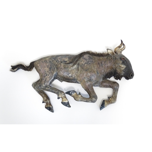 177 - A Sallie Wakley (b. 1967) studio pottery wall hanging plaque modelled as a water buffalo. Together w... 