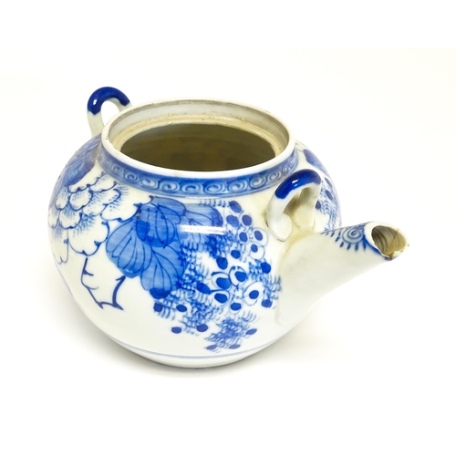 186 - A quantity of Chinese items to include a blue and white teapot with peony flower detail, a blue and ... 