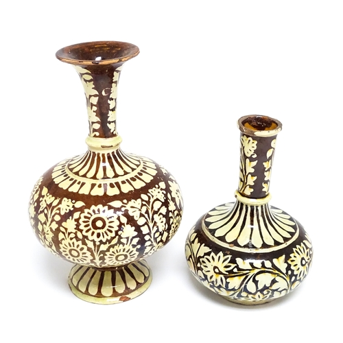 195 - Two earthenware vases with floral and foliate decoration. One with Islamic script under. Largest app... 