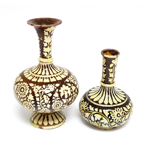 195 - Two earthenware vases with floral and foliate decoration. One with Islamic script under. Largest app... 