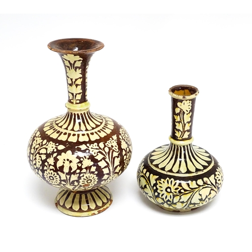 195 - Two earthenware vases with floral and foliate decoration. One with Islamic script under. Largest app... 