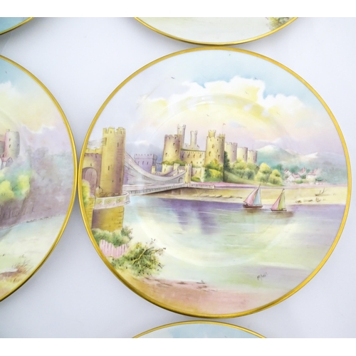 202 - A set of twelve Minton plates depicting castles of the United Kingdom to include Stirling Castle, Ed... 