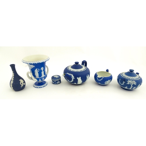 204 - A quantity of Wedgwood dark blue jasperware items with applied white Classical figures and motifs to... 