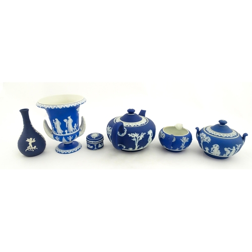 204 - A quantity of Wedgwood dark blue jasperware items with applied white Classical figures and motifs to... 