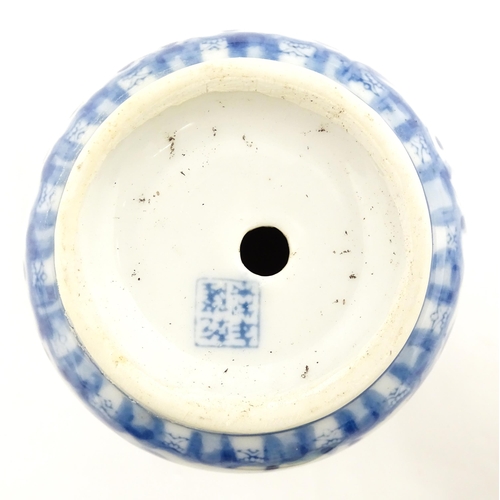 205 - A Chinese yellow ground planter with floral detail. Character marks under. Together with four blue a... 