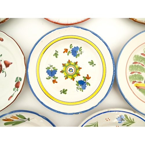 211 - Eight assorted faience plates decoration to include goat in landscape, flowers and foliage, etc. App... 