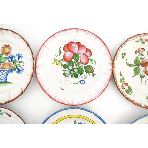 211 - Eight assorted faience plates decoration to include goat in landscape, flowers and foliage, etc. App... 