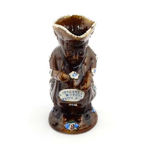 217 - A Victorian Measham bargeware Toby / Character jug modelled as the Snuff Taker, bearing the motto A ... 