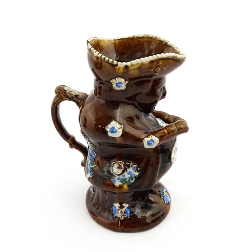 217 - A Victorian Measham bargeware Toby / Character jug modelled as the Snuff Taker, bearing the motto A ... 