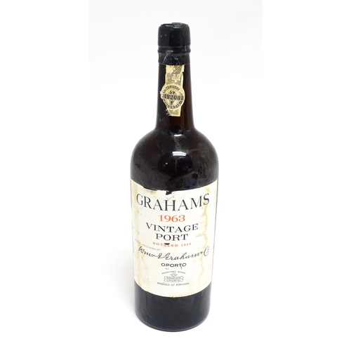 1145 - A bottle of Grahams 1963 vintage port (approx 75cl)