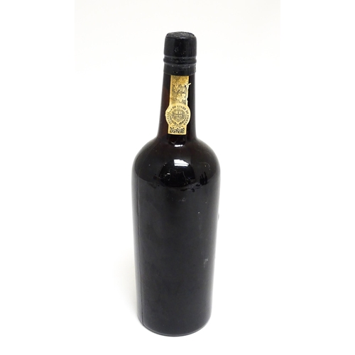 1145 - A bottle of Grahams 1963 vintage port (approx 75cl)