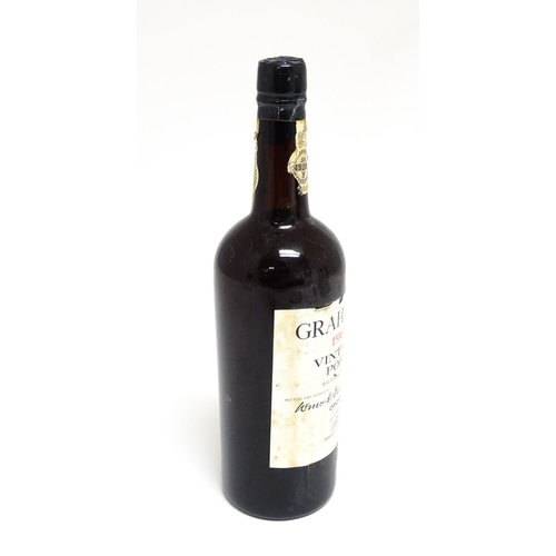 1145 - A bottle of Grahams 1963 vintage port (approx 75cl)