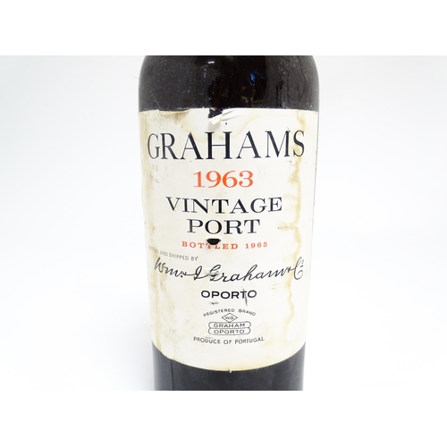 1145 - A bottle of Grahams 1963 vintage port (approx 75cl)