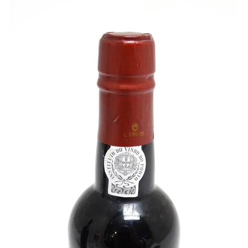 1148 - Two bottles of port, comprising a Croft vintage 1970 (approx 75cl) and a 37.5cl bottle of Porto Kroh... 