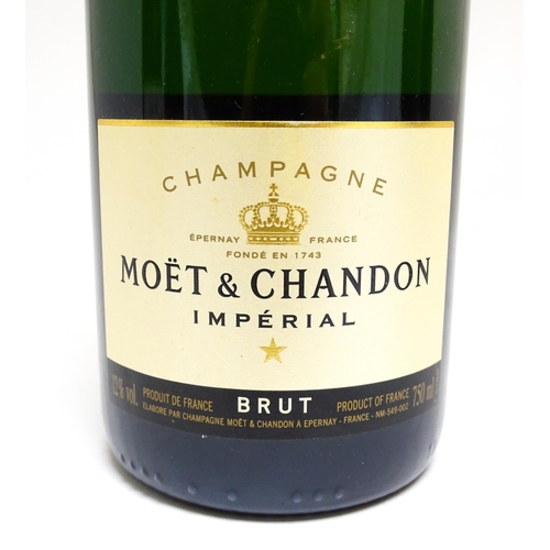 1156 - Four bottles of champagne, comprising a 750ml bottle of Moët & Chandon Imperial brut, a 75cl bottle ... 