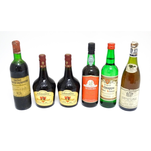 1158 - Six assorted wines and spirits, comprising a 73cl bottle of Château Malartic-Lagravière cru classe d... 