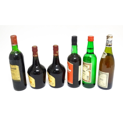 1158 - Six assorted wines and spirits, comprising a 73cl bottle of Château Malartic-Lagravière cru classe d... 