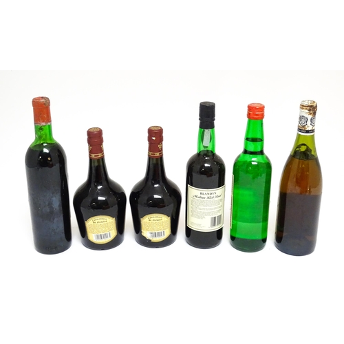 1158 - Six assorted wines and spirits, comprising a 73cl bottle of Château Malartic-Lagravière cru classe d... 