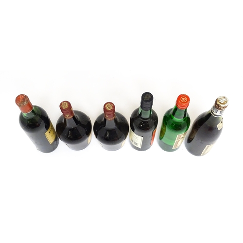 1158 - Six assorted wines and spirits, comprising a 73cl bottle of Château Malartic-Lagravière cru classe d... 