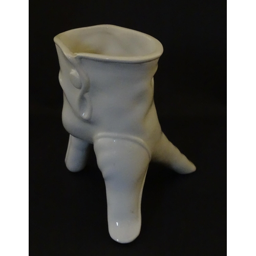 164 - A Leo Bonassera studio pottery novelty vase modelled as a white glove. Marked to underside. Approx. ... 