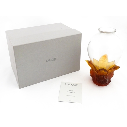 257 - A boxed limited edition Lalique Pivoines glass vase with high relief amber floral base. Limited edit... 