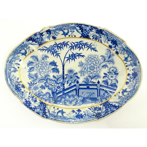 64 - A quantity of Davenport dinner wares in the Bamboo and Peony pattern to include plates and serving d... 