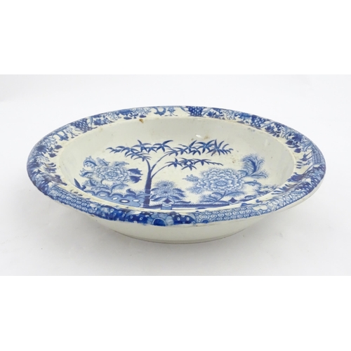 64 - A quantity of Davenport dinner wares in the Bamboo and Peony pattern to include plates and serving d... 