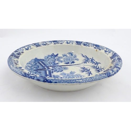 64 - A quantity of Davenport dinner wares in the Bamboo and Peony pattern to include plates and serving d... 