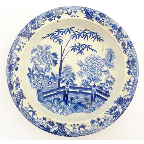 64 - A quantity of Davenport dinner wares in the Bamboo and Peony pattern to include plates and serving d... 