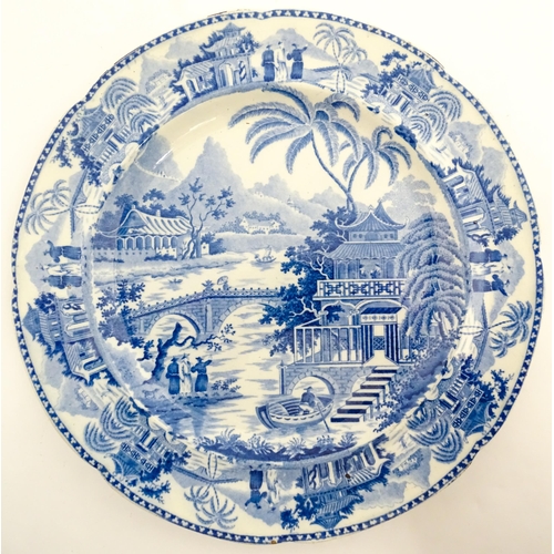 65 - A blue and white plate decorated in the Bridge and Pagoda pattern. Possibly by Thomas and John Carey... 