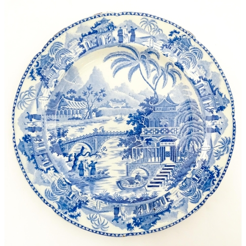 65 - A blue and white plate decorated in the Bridge and Pagoda pattern. Possibly by Thomas and John Carey... 