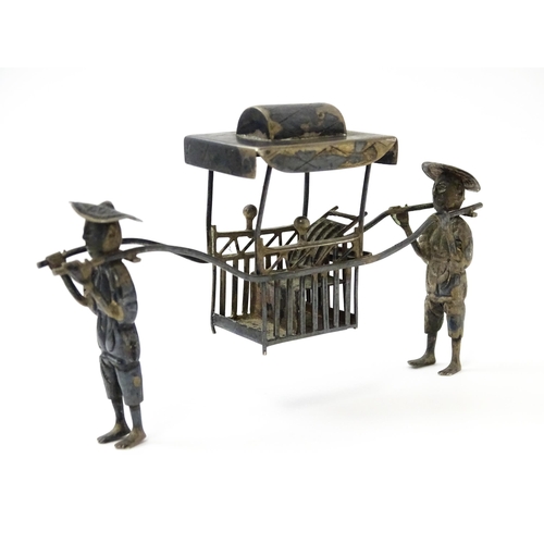 397 - A Chinese export silver model of two figures carrying a sedan chair. Marked with Oriental character ... 