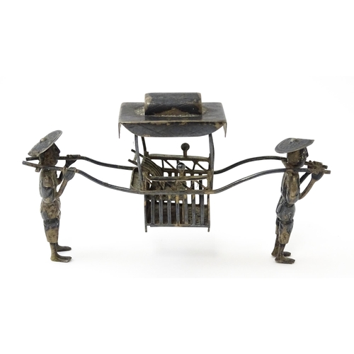 397 - A Chinese export silver model of two figures carrying a sedan chair. Marked with Oriental character ... 